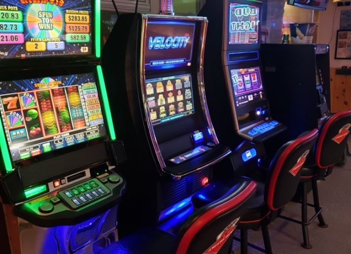 Gambling machines in a line. RJ’s On the Lake is full-service restaurant located on beautiful Sand Lake with award-winning pizza.