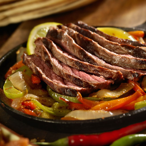 Grilled steak sautéed with onions and peppers, all on a sizzling platter. Served with sides of guacamole, sour cream, cheese, homemade salsa and your choice of flour or corn tortillas.