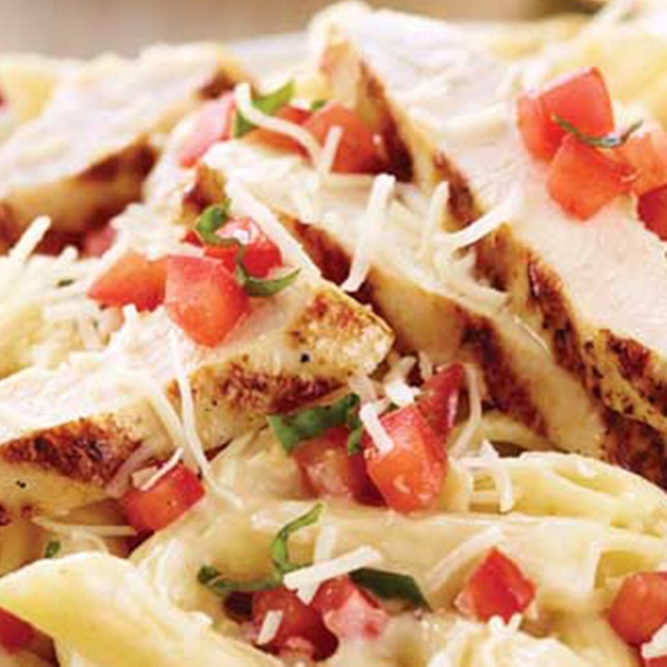 Tender, blackened chicken served over penne tossed with fresh spinach, garlic, tomatoes and creamy Alfredo, then sprinkled with Parmesan.